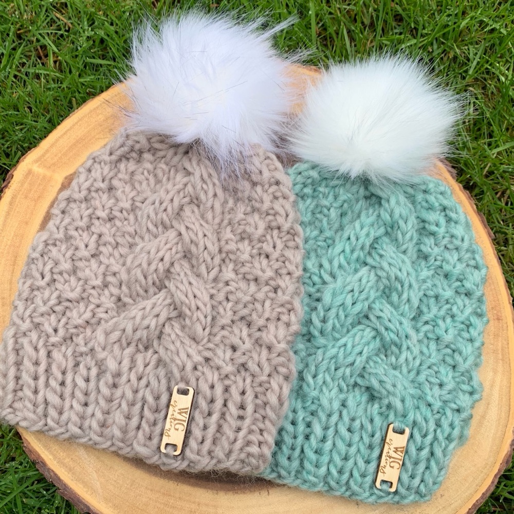 Soft cable knit hat with faux fur pom